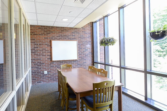 Stever House Study Room - table and chairs white board plants and large windows